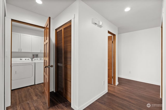washroom featuring cabinet space, dark wood-style floors, separate washer and dryer, recessed lighting, and baseboards