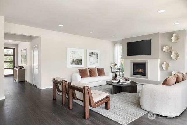 16331 25th St E, Lake Tapps, WA 98391 - living room with recessed lighting, dark wood-style flooring, a lit fireplace, and baseboards