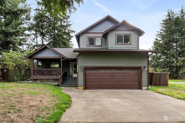 craftsman-style house with a front yard, a garage, and a porch