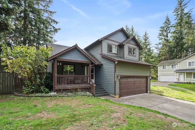 view of front of home with a garage, a front lawn, and a porch