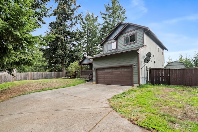 view of front facade with a front yard and a garage