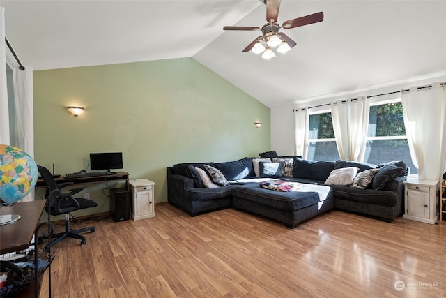 living room featuring lofted ceiling, light hardwood / wood-style floors, and ceiling fan