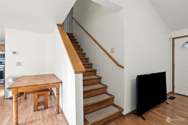 foyer entrance with light wood-type flooring