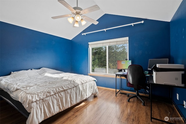 bedroom featuring ceiling fan, vaulted ceiling, and wood-type flooring