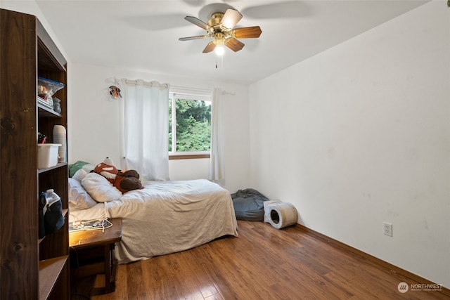 bedroom featuring ceiling fan and wood-type flooring