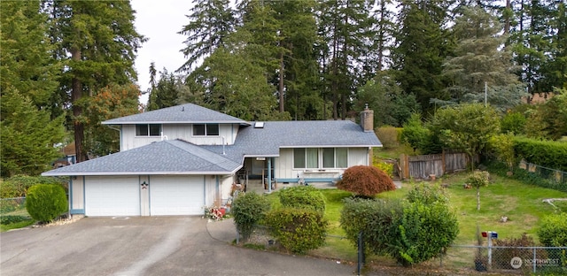 split level home with a front yard