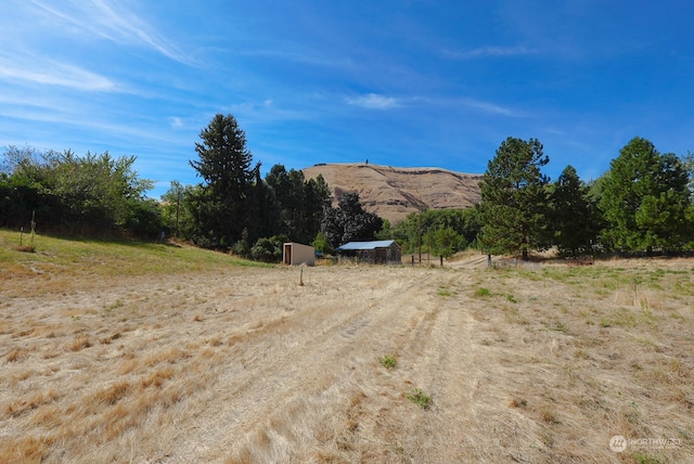 view of street featuring a rural view and a mountain view