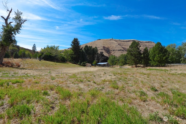 property view of mountains featuring a rural view