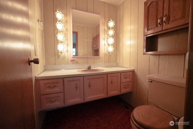 bathroom featuring toilet and vanity