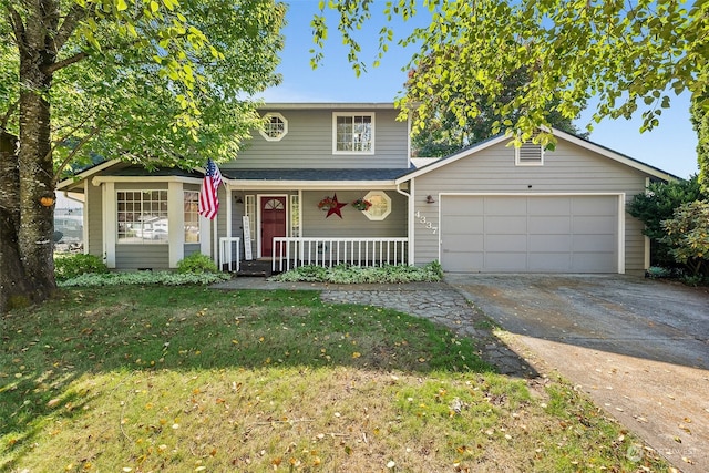 front of property with a garage, a front lawn, and a porch