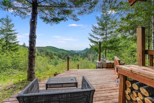 wooden deck featuring a mountain view