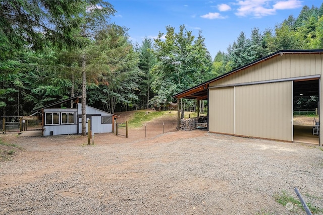 view of side of property with an outbuilding