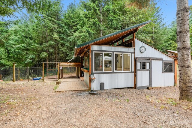 back of property with an outbuilding