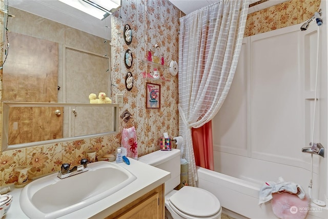 bathroom with vanity, shower / bathtub combination with curtain, toilet, and wallpapered walls