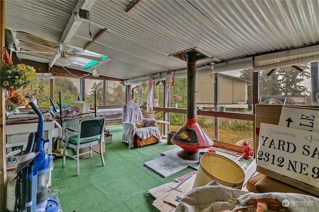 sunroom / solarium featuring ceiling fan and a healthy amount of sunlight