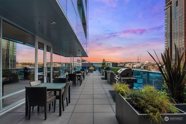 patio terrace at dusk with area for grilling