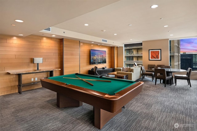 recreation room featuring wood walls, billiards, and dark colored carpet