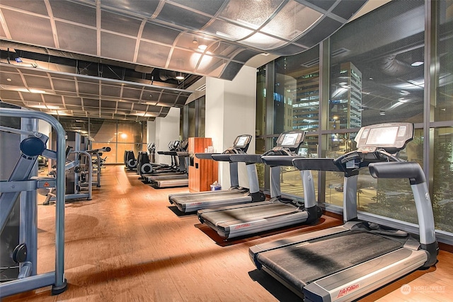 gym with wood-type flooring