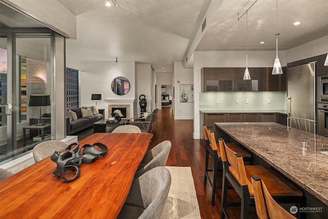 dining room with dark wood-type flooring