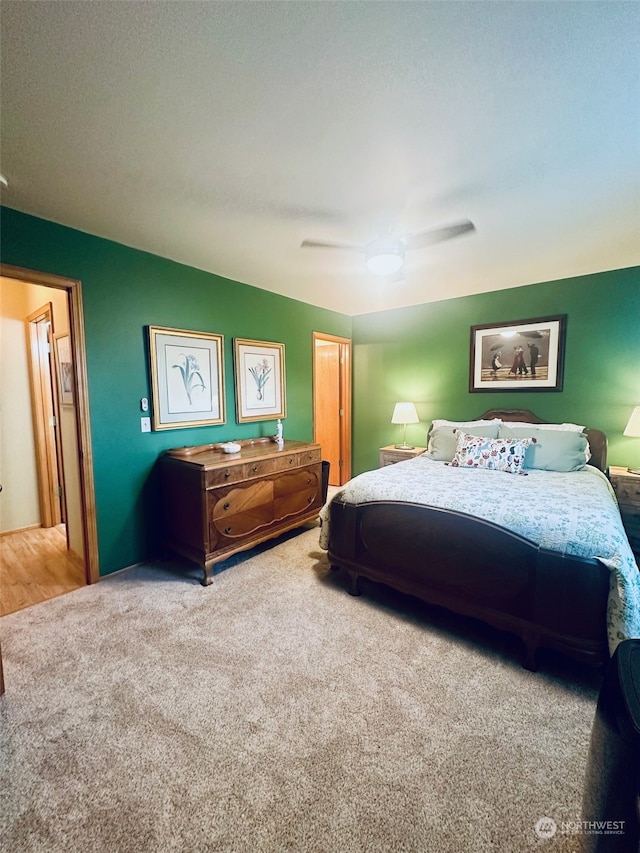 bedroom with ceiling fan and carpet floors