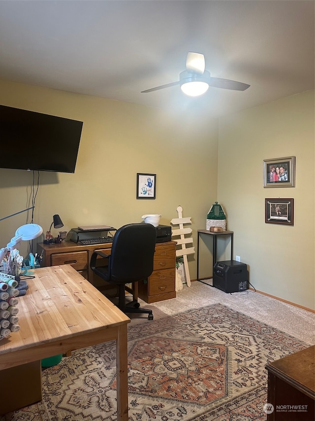 office area with ceiling fan and carpet floors