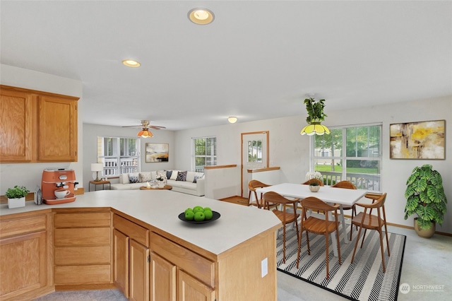 kitchen with light carpet and ceiling fan