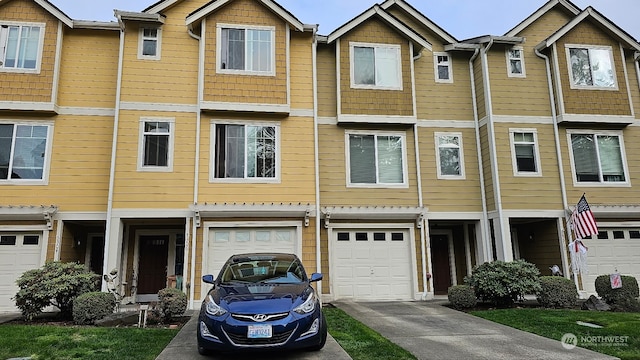 townhome / multi-family property featuring a garage