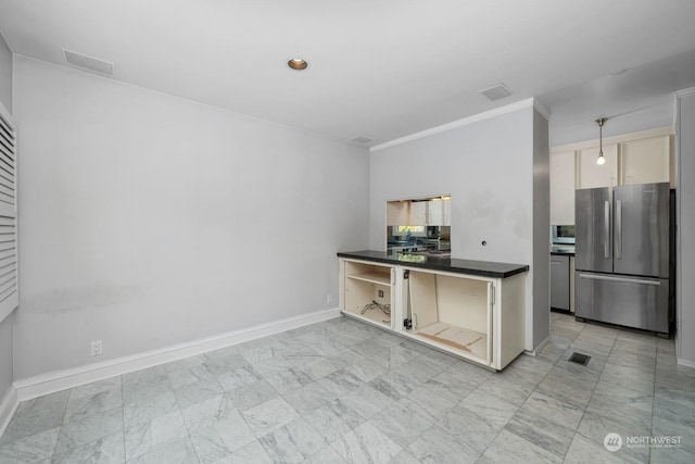 kitchen featuring stainless steel appliances and hanging light fixtures