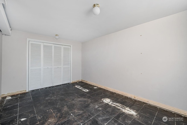 unfurnished bedroom with a closet