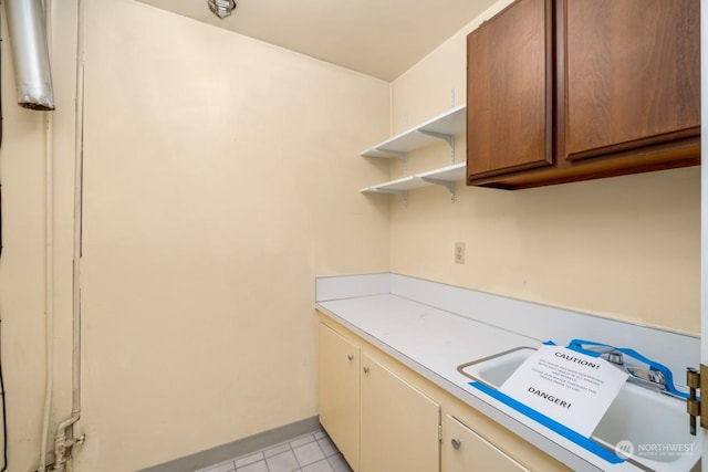 laundry room with light tile patterned floors