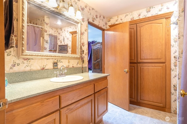 bathroom featuring tile patterned flooring and vanity