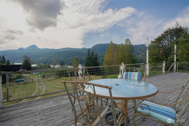 wooden deck with a mountain view