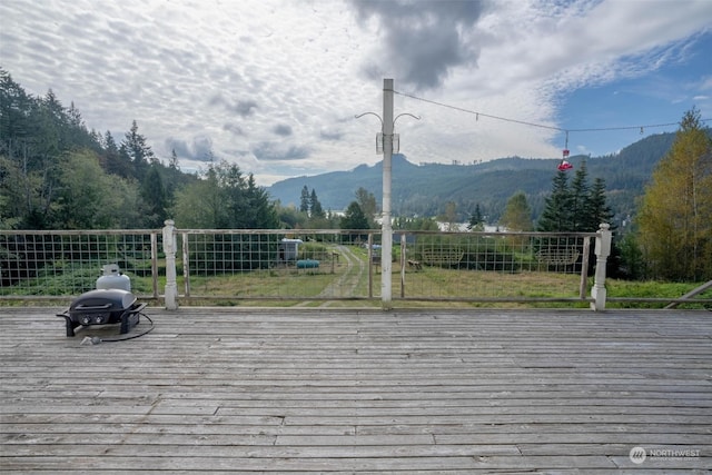 wooden deck with a mountain view