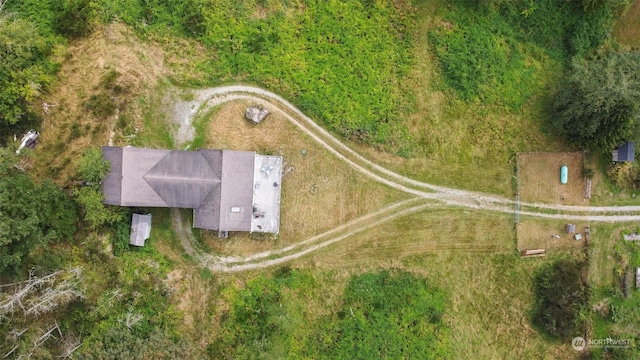 birds eye view of property with a rural view