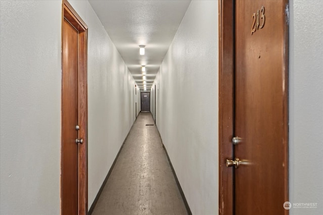 corridor with light hardwood / wood-style flooring