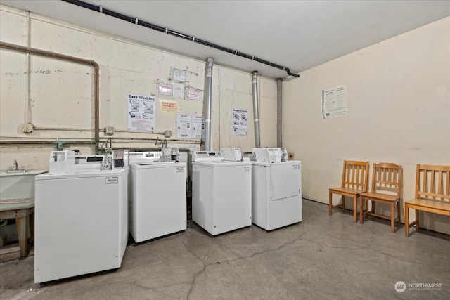 clothes washing area with washer and dryer