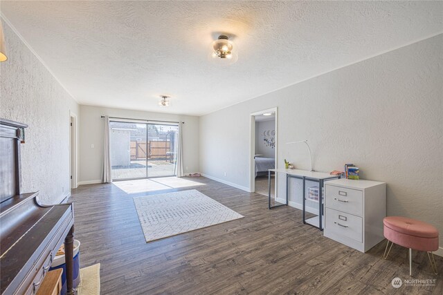 interior space featuring a textured ceiling and dark hardwood / wood-style floors