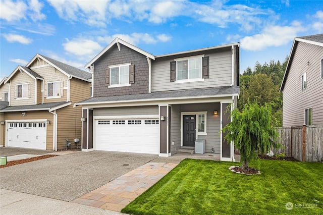 view of front facade with a front yard and a garage