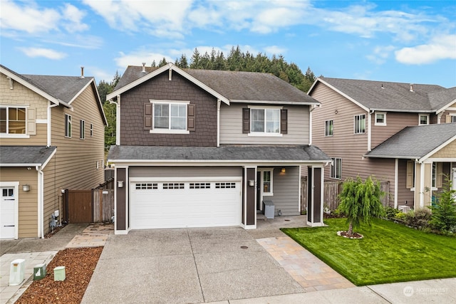 view of front facade featuring a garage and a front yard