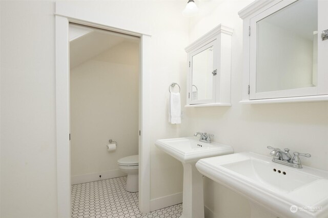 267 Compass St, Pacific Beach, WA 98571 - bathroom featuring baseboards, a sink, and toilet