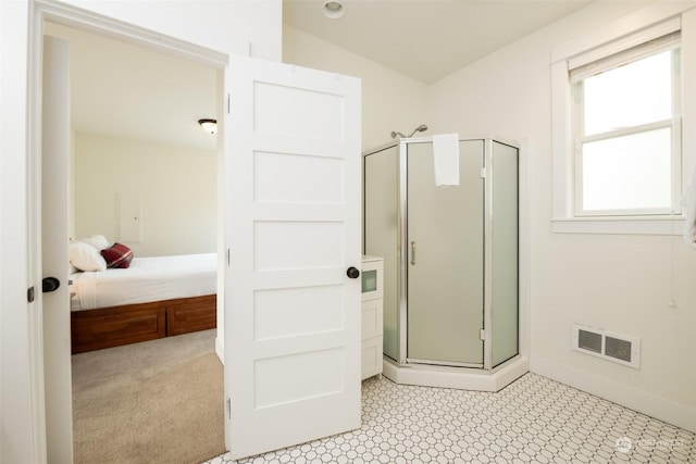 267 Compass St, Pacific Beach, WA 98571 - ensuite bathroom featuring a shower stall, ensuite bath, visible vents, lofted ceiling, and baseboards
