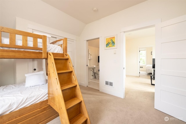 267 Compass St, Pacific Beach, WA 98571 - bedroom featuring visible vents, light carpet, and lofted ceiling