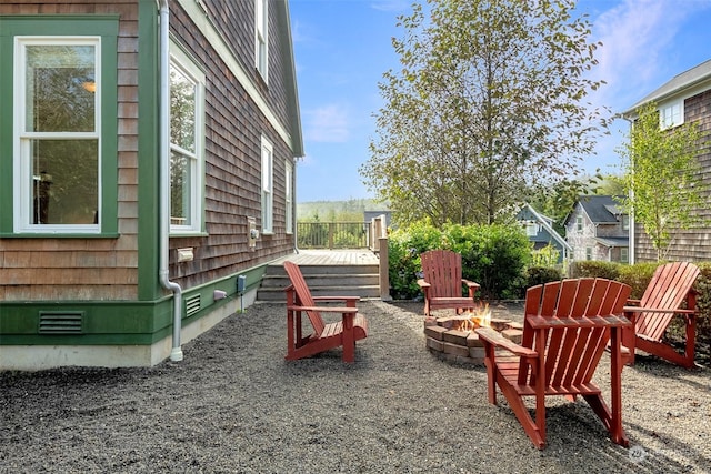 267 Compass St, Pacific Beach, WA 98571 - view of yard featuring a wooden deck and an outdoor fire pit