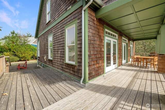 267 Compass St, Pacific Beach, WA 98571 - wooden terrace featuring french doors and outdoor dining space