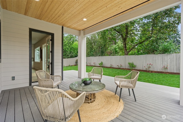 wooden terrace with a yard