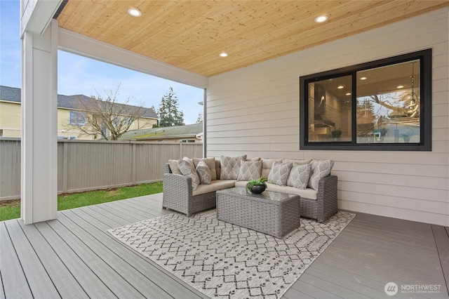 wooden terrace featuring fence and an outdoor hangout area