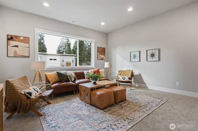 carpeted living room with baseboards, visible vents, and recessed lighting