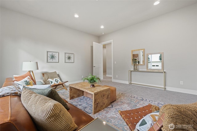 living room featuring carpet floors, baseboards, and recessed lighting