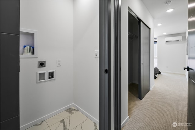 corridor with light colored carpet and an AC wall unit