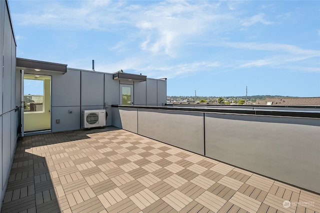 view of patio featuring a balcony and ac unit